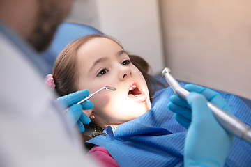 Image showing Young caucasian girl visiting dentist\'s office