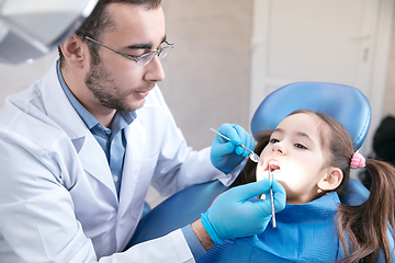 Image showing Young caucasian girl visiting dentist\'s office