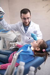 Image showing Young caucasian girl visiting dentist\'s office