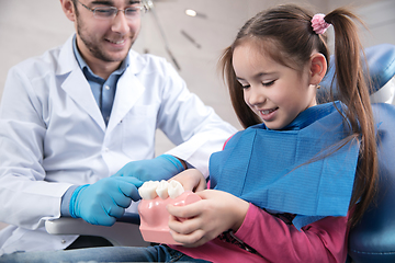 Image showing Young caucasian girl visiting dentist\'s office