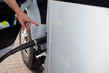 Image showing Car refueling on a petrol station with somebody