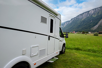 Image showing Caravan car vacation. Family vacation travel RV. Holiday trip in motorhome. Switzerland natural landscape