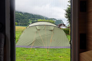 Image showing The view from inside the motorhome directly to the tourist tent