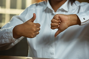 Image showing Close up of african-american and caucasian human\'s hands gesturing