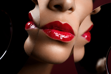 Image showing beautiful woman lips closeup with mirror reflections