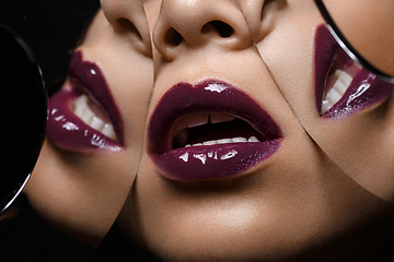 Image showing beautiful woman lips closeup with mirror reflections