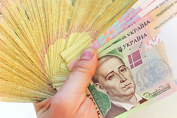 Image showing Ukrainian money in the hand