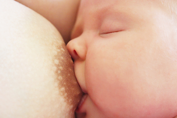 Image showing mother breastfeeding baby