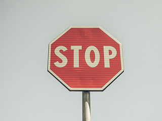 Image showing Vintage looking Stop sign over blue sky