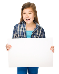 Image showing Little girl is holding a blank banner