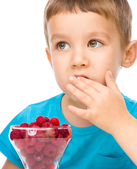 Image showing Little boy with raspberries