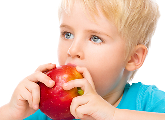 Image showing Portrait of a cute little boy with red apple