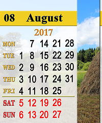 Image showing calendar for August 2017 with stacks in village