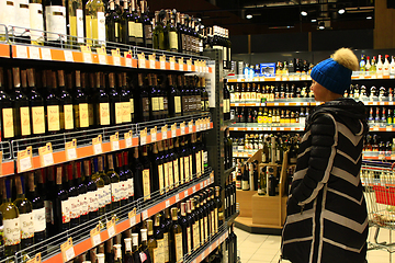 Image showing woman choises Store of alcoholic drinks