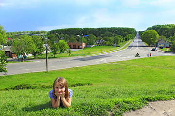 Image showing little girl lies on the grass