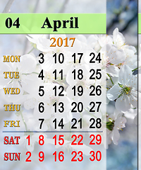 Image showing calendar for May 2017 with blooming cherry tree