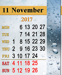 Image showing calendar for November 2017 with drops of rain on the glass