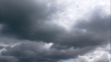 Image showing Time lapse Nature background Ominous clouds drift slowly across the sky, threatening rain. UltraHD stock footage