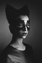 Image showing girl with horns hairstyle in leather mask