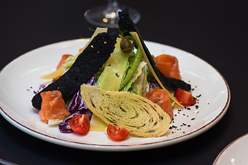 Image showing Caesar salad with salmon fish