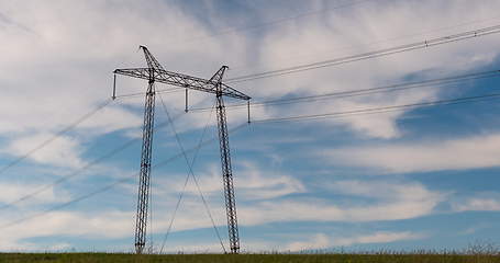 Image showing cloudy morning sky and a high-voltage line