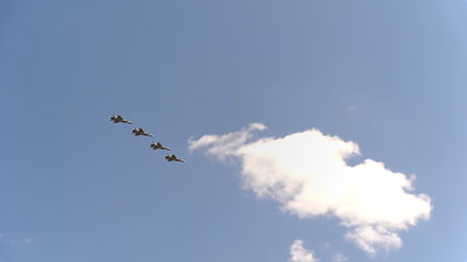 Image showing Four fighters Mig-31 fly in blue sky