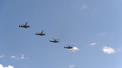 Image showing Combat helicopters Ka-52 fly in blue sky