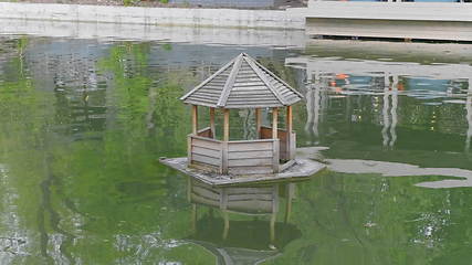 Image showing Wooden Duck House on a Pond in Rural.