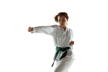 Image showing Confident junior in kimono practicing hand-to-hand combat, martial arts