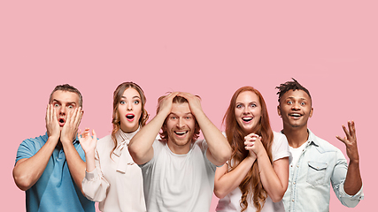 Image showing Portrait of multiethnic group of young people isolated on pink studio background, flyer, collage