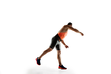 Image showing Male athlete practicing in throwing javelin isolated on white studio background