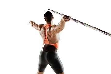 Image showing Male athlete practicing in throwing javelin isolated on white studio background