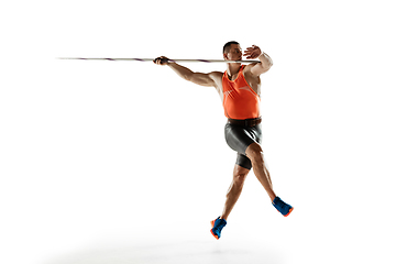 Image showing Male athlete practicing in throwing javelin isolated on white studio background