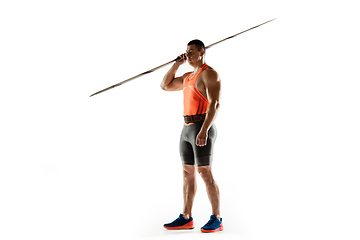 Image showing Male athlete practicing in throwing javelin isolated on white studio background