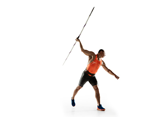 Image showing Male athlete practicing in throwing javelin isolated on white studio background