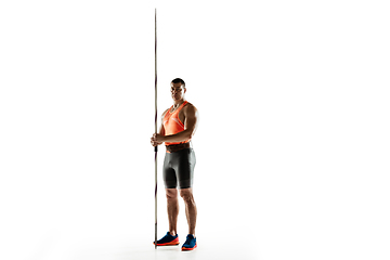 Image showing Male athlete practicing in throwing javelin isolated on white studio background