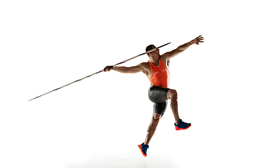 Image showing Male athlete practicing in throwing javelin isolated on white studio background