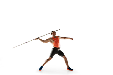 Image showing Male athlete practicing in throwing javelin isolated on white studio background