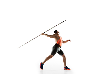 Image showing Male athlete practicing in throwing javelin isolated on white studio background