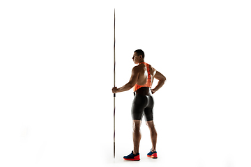 Image showing Male athlete practicing in throwing javelin isolated on white studio background