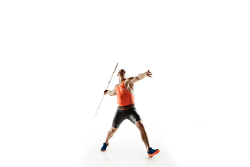 Image showing Male athlete practicing in throwing javelin isolated on white studio background