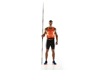 Image showing Male athlete practicing in throwing javelin isolated on white studio background