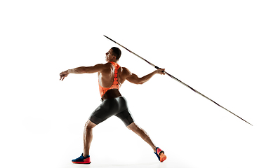 Image showing Male athlete practicing in throwing javelin isolated on white studio background