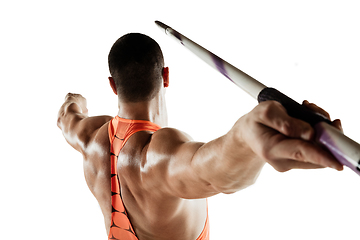 Image showing Male athlete practicing in throwing javelin isolated on white studio background