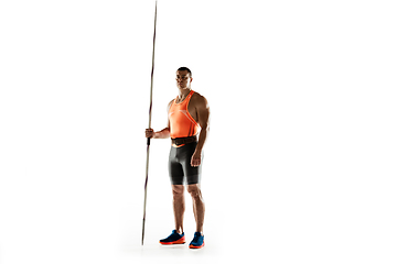 Image showing Male athlete practicing in throwing javelin isolated on white studio background