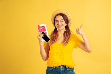 Image showing Caucasian woman\'s portrait isolated on yellow studio background