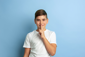 Image showing Caucasian teen\'s portrait isolated on blue studio background