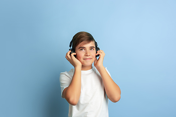 Image showing Caucasian teen\'s portrait isolated on blue studio background