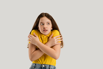 Image showing Caucasian girl isolated on white studio background. Copyspace. Childhood, education, emotions concept