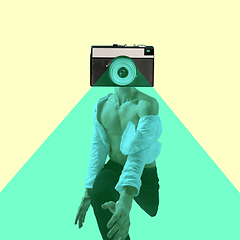 Image showing Contemporary art collage, modern design. Retro style. Beautiful male dancer headed by retro camera running on yellow background